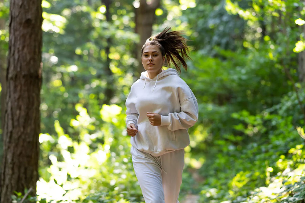 Person exercising outdoors to support long-term health and disease prevention