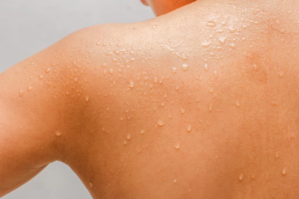 Person sweating after exercise, representing detoxification and improved circulation
