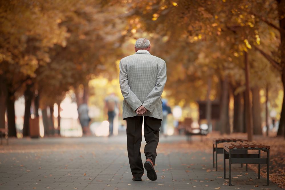 man walkingPerson practicing walking meditation outdoors with focus and calm